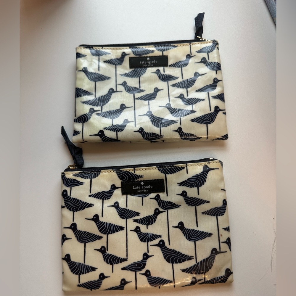 Pair of blue and cream Kate Spade makeup bags in good condition